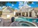 Resort-style backyard features a swimming pool, spa, patio, and ample seating areas at 2625 N 24Th St # 15, Mesa, AZ 85213