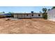 A spacious backyard featuring a patio and plenty of room for outdoor activities at 313 N 101St Way, Mesa, AZ 85207