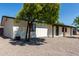 A charming single-story home with desert landscaping, a nice tree, and an inviting curb appeal at 313 N 101St Way, Mesa, AZ 85207