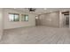 Open living room features large windows, neutral paint, recessed lighting and tile floors at 313 N 101St Way, Mesa, AZ 85207