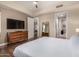 Relaxing bedroom featuring modern decor, wood floors, and access to the kitchen and bathroom at 3131 N Central Ave # 3004, Phoenix, AZ 85012