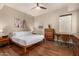 Bright bedroom featuring wood floors, a ceiling fan, and mid-century modern furniture and decor at 3131 N Central Ave # 3004, Phoenix, AZ 85012