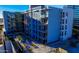 Contemporary blue apartment building featuring private balconies and modern landscaping at 3131 N Central Ave # 3004, Phoenix, AZ 85012
