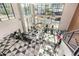 Bright, modern gym space with high ceilings, black and white patterned floor, and state-of-the-art exercise equipment at 3131 N Central Ave # 3004, Phoenix, AZ 85012