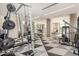 Well-equipped gym featuring a variety of weight machines and a contemporary black and white patterned floor at 3131 N Central Ave # 3004, Phoenix, AZ 85012