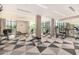 Bright fitness center with large windows, ample exercise equipment, and sleek black and white patterned floors at 3131 N Central Ave # 3004, Phoenix, AZ 85012