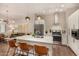 Modern kitchen with stainless steel appliances, a white island, and hardwood floors at 3131 N Central Ave # 3004, Phoenix, AZ 85012