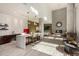 Modern open kitchen and living space with unique pendant lighting, a retro red refrigerator, and hardwood floors at 3131 N Central Ave # 3004, Phoenix, AZ 85012