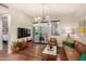 Open living room with stylish decor, hardwood floors, and access to a private balcony at 3131 N Central Ave # 3004, Phoenix, AZ 85012