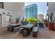Stylish outdoor lounge with cacti and comfortable seating with a view of the city at 3131 N Central Ave # 3004, Phoenix, AZ 85012