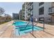 Inviting pool area featuring a clear blue pool, spa, and modern building facade at 3131 N Central Ave # 3004, Phoenix, AZ 85012