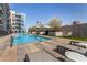 Inviting swimming pool area with lounge chairs and lush landscaping at 3131 N Central Ave # 3004, Phoenix, AZ 85012