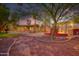 Backyard featuring a covered patio, outdoor kitchen, and desert landscaping at 3204 N Jay St, Chandler, AZ 85225