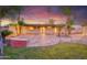 Mature landscaped backyard featuring a covered patio and outdoor lighting at 3204 N Jay St, Chandler, AZ 85225