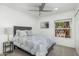 Comfortable bedroom with neutral tones, plush bedding, and a window with natural light at 3204 N Jay St, Chandler, AZ 85225