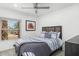 Comfortable bedroom featuring a ceiling fan, modern decor, and a window with a view at 3204 N Jay St, Chandler, AZ 85225