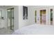 Bedroom showcasing a plush bed, direct access to the backyard, and an ensuite bathroom at 3204 N Jay St, Chandler, AZ 85225