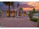 Attractive desert home with palm trees, rock landscaping, and a charming front entrance walkway at 3204 N Jay St, Chandler, AZ 85225