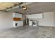 Spacious garage with white cabinets, a water heater, and a washer/dryer hookup at 3204 N Jay St, Chandler, AZ 85225