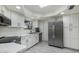 Bright kitchen features white cabinets, stainless steel appliances and tile floors at 3204 N Jay St, Chandler, AZ 85225