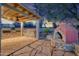 Outdoor kitchen with a built-in grill, bar, and pizza oven at 3204 N Jay St, Chandler, AZ 85225