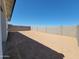 Spacious backyard with a block wall, offering privacy and ample space for outdoor activities and landscaping at 3510 N Camden Dr, Florence, AZ 85132
