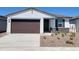 Charming single-story home featuring a two-car garage, stone accents, and a well-maintained gravel front yard at 3510 N Camden Dr, Florence, AZ 85132