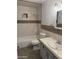 Well-maintained bathroom featuring a shower-tub combo, tile accents, and a single sink vanity at 3734 W Dailey St, Phoenix, AZ 85053