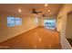 Large bonus room showcasing recessed lights, two ceiling fans, tile flooring, and a sliding glass door at 3734 W Dailey St, Phoenix, AZ 85053