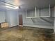 Spacious garage with ample storage, built in cabinets, and an automatic garage door opener at 3734 W Dailey St, Phoenix, AZ 85053