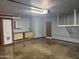 Garage view featuring built in cabinets, automatic garage door opener, and clean epoxy floor at 3734 W Dailey St, Phoenix, AZ 85053