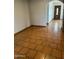 Inviting room with eye-catching tile flooring, arched doorway, and natural light streaming through the entrance at 3734 W Dailey St, Phoenix, AZ 85053