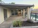 Covered patio with sliding glass doors, ceiling fan, neutral color palette and manicured landscaping at 3734 W Dailey St, Phoenix, AZ 85053