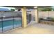 Covered patio and pool featuring concrete flooring, pool fence and brick fence for privacy at 3734 W Dailey St, Phoenix, AZ 85053