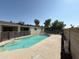 Backyard pool featuring cool blue water with deck, fence and clear blue skies on a sunny day at 3734 W Dailey St, Phoenix, AZ 85053