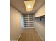 Well-organized walk-in closet offering carpet flooring, shelving, and a convenient clothing rod at 3734 W Dailey St, Phoenix, AZ 85053