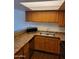 Kitchen featuring stainless steel sink, laminate countertops and wooden cabinetry at 3810 N Maryvale Pkwy # 2077, Phoenix, AZ 85031