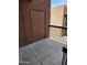 Outdoor patio space with dark brown exterior and black railing at 3810 N Maryvale Pkwy # 2077, Phoenix, AZ 85031