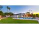 Spacious backyard with pool, artificial grass, playground and covered patio perfect for outdoor entertaining at 4040 E Becker Ln, Phoenix, AZ 85028