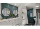 Modern bathroom with double sinks, decorative tile, and spa shower at 4040 E Becker Ln, Phoenix, AZ 85028