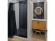 Stylish bathroom with modern vanity, tiled shower and designer mirror at 4040 E Becker Ln, Phoenix, AZ 85028