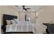 Comfortable bedroom featuring ceiling fan, closet, and study nook at 4040 E Becker Ln, Phoenix, AZ 85028
