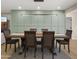 Dining room with sleek lighting and an adjacent living space at 4040 E Becker Ln, Phoenix, AZ 85028