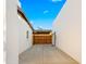 Wide driveway with wood gate that provides access to the backyard at 4040 E Becker Ln, Phoenix, AZ 85028