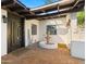 Charming entrance featuring a decorative fountain, brick paving, and a wooden-style door at 4040 E Becker Ln, Phoenix, AZ 85028