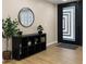 Welcoming entryway featuring a round mirror, storage cubbies, and a modern door at 4040 E Becker Ln, Phoenix, AZ 85028