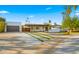 Beautiful desert home with a two-car garage, carport, and nicely manicured landscaping at 4040 E Becker Ln, Phoenix, AZ 85028