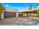 Modern home exterior featuring a garage and covered parking area at 4040 E Becker Ln, Phoenix, AZ 85028