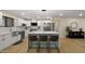 Open concept kitchen with a quartz countertop island and a stainless steel fridge at 4040 E Becker Ln, Phoenix, AZ 85028