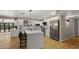 Spacious white kitchen with modern stainless steel appliances and a large center island at 4040 E Becker Ln, Phoenix, AZ 85028